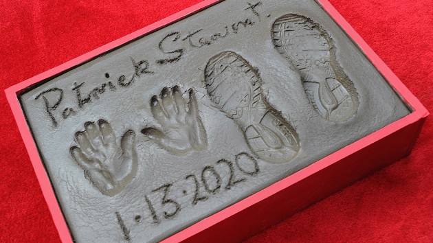 Patrick Stewart enthusiastically gets his hands and feet dirty at his hand and footprint ceremony